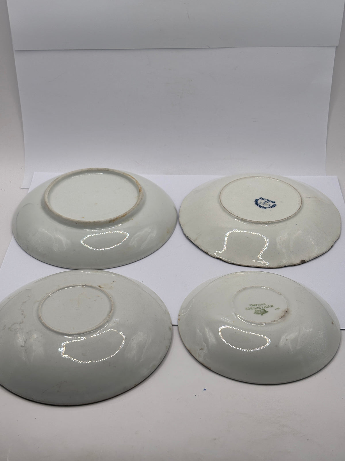 4 old decorative saucers (all dump dug)