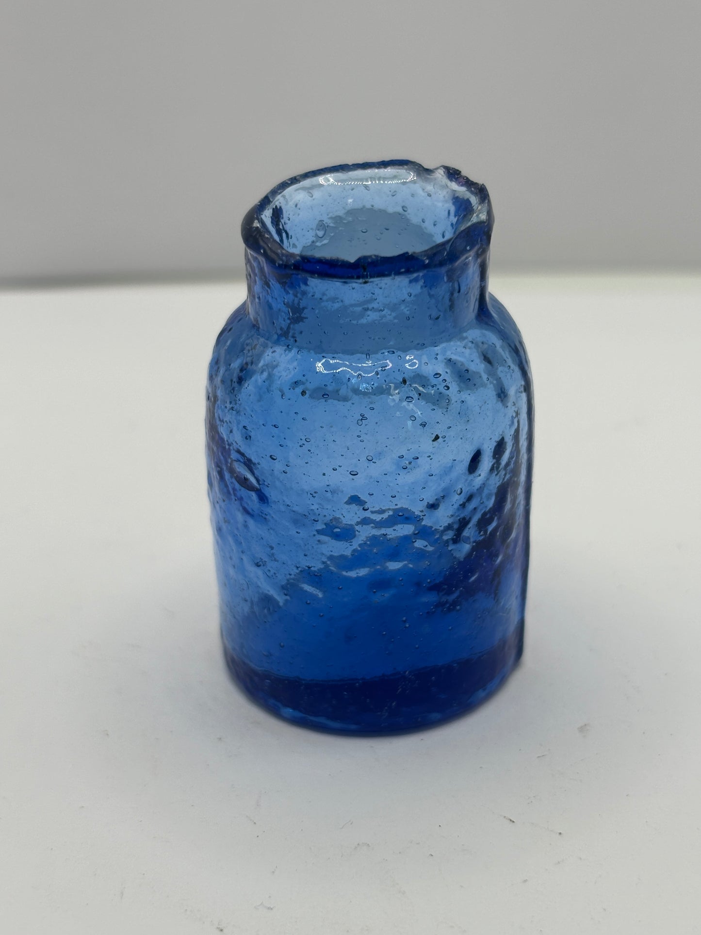 Small blue rat paste bottle