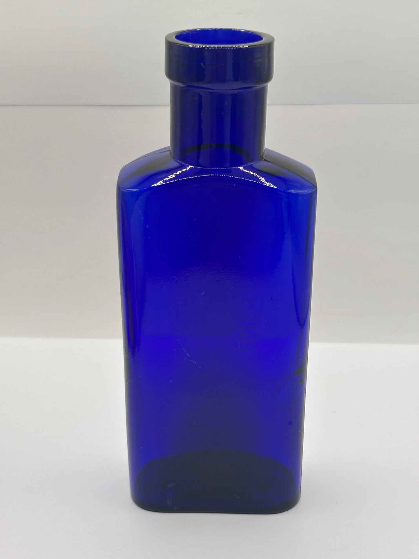Old blue glass advertising bottle, Granular citrate of magnesia