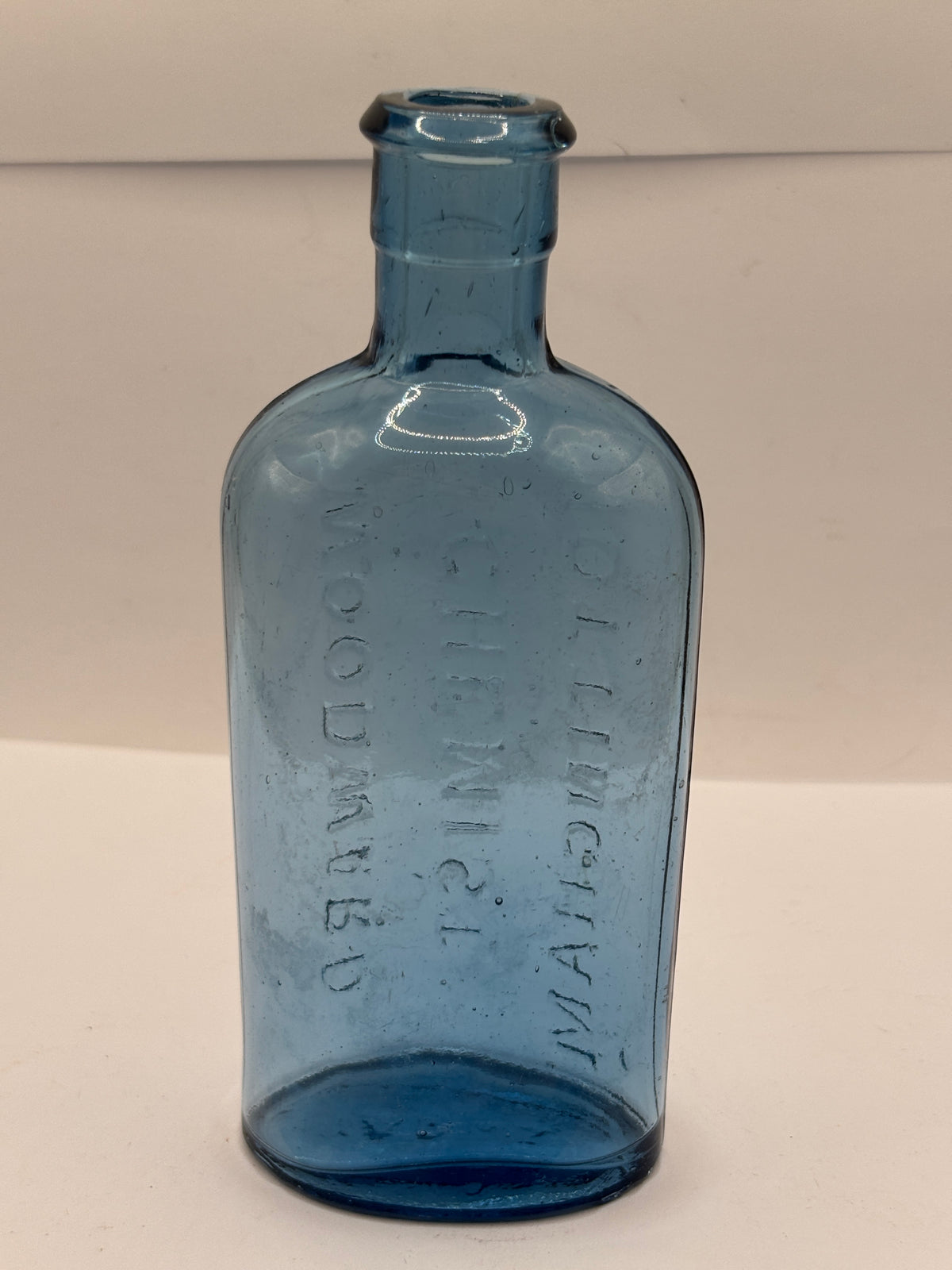 Old blue glass chemist bottle, Woodwards chemist Nottingham