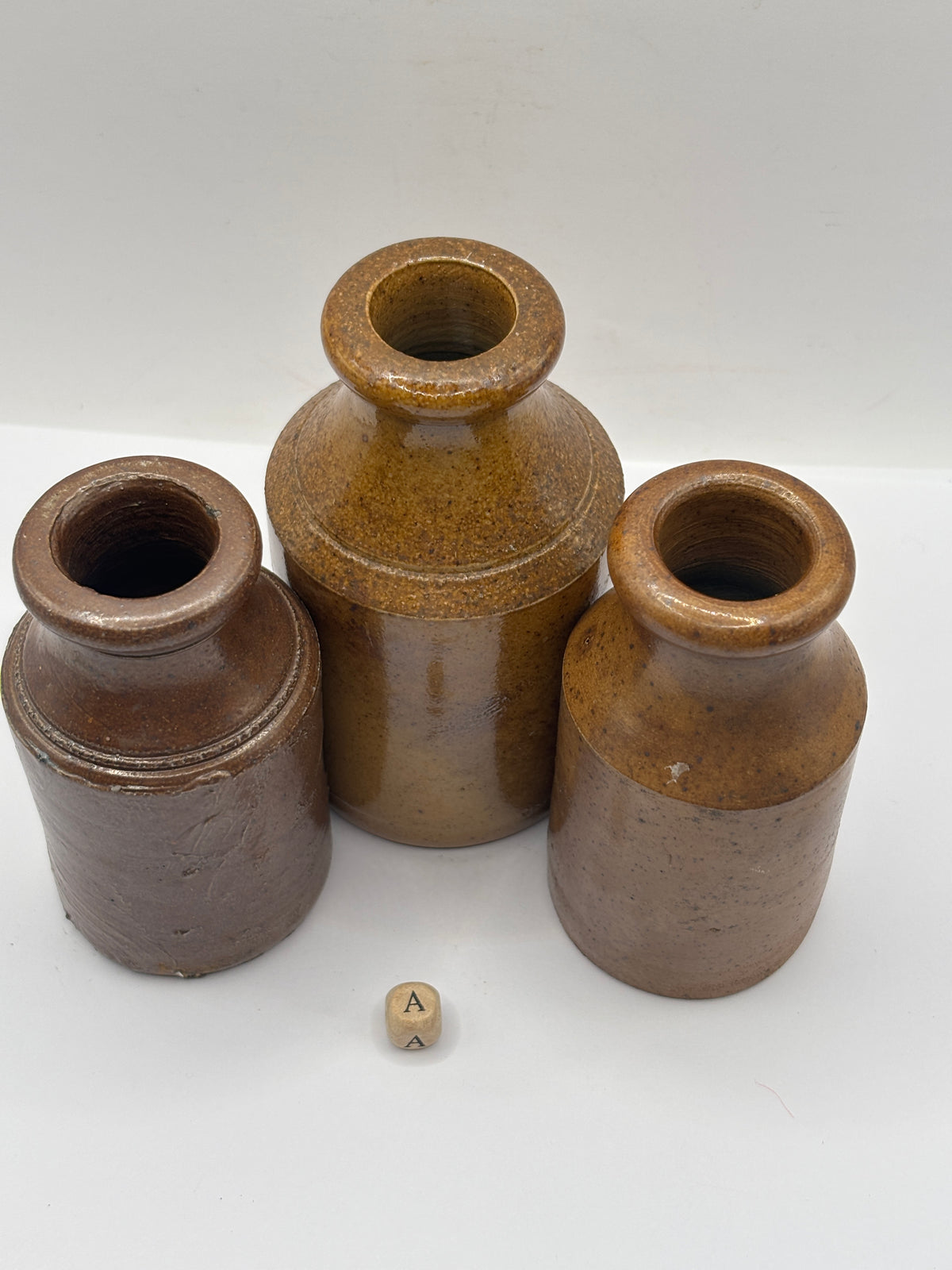 3 tall brown stoneware pots (a)