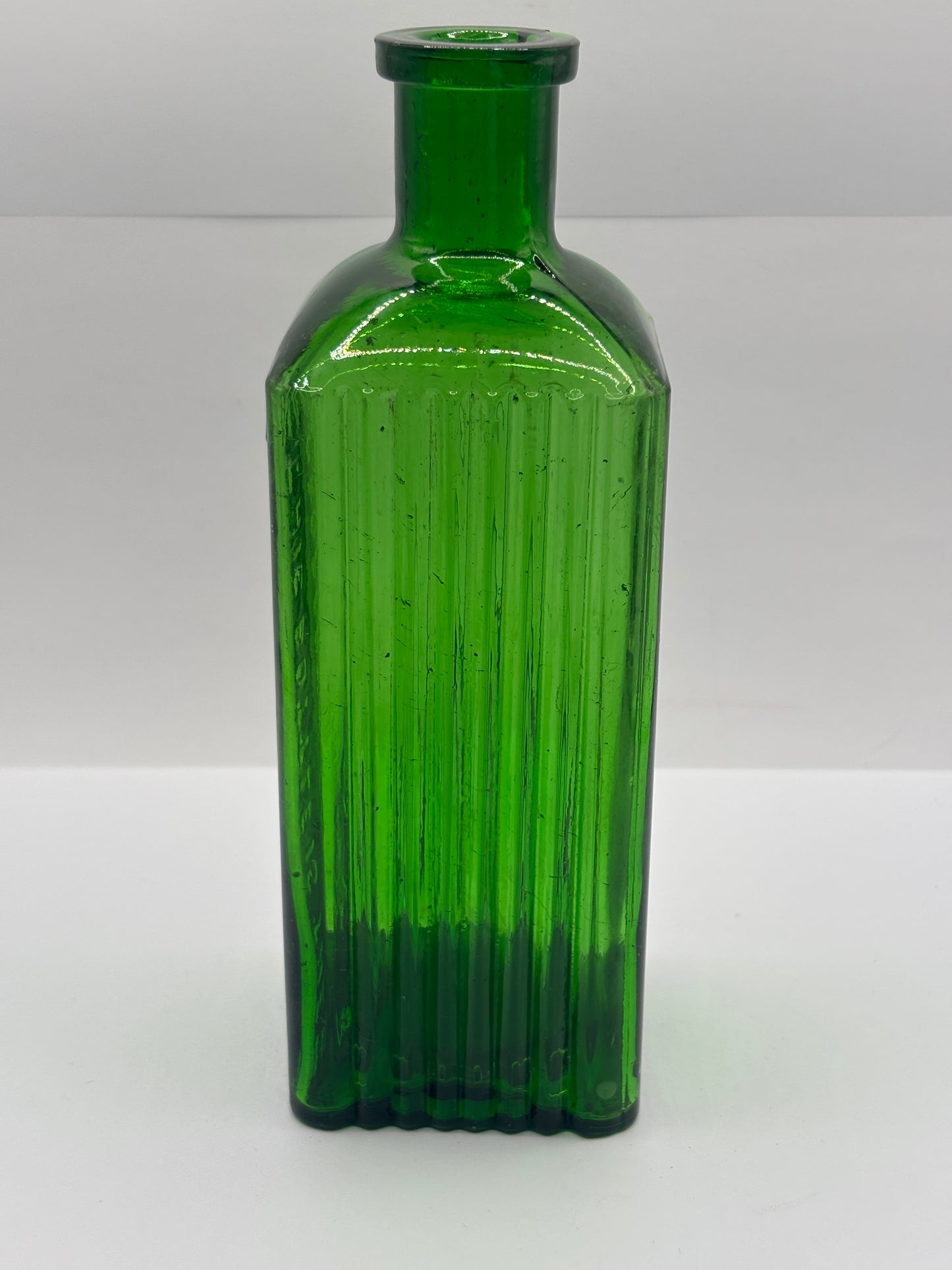 Old green glass poison bottle, Sheffield corporation poison bottle. Chipped