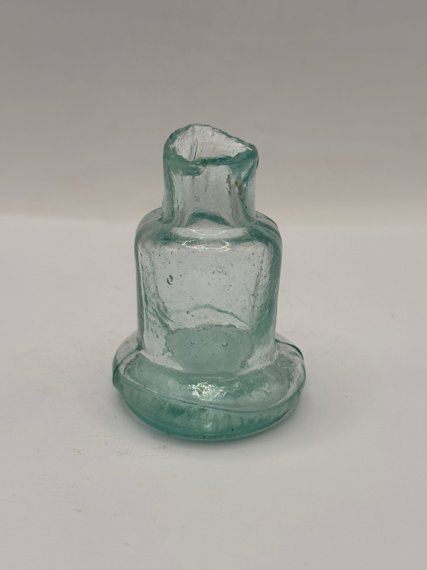 Old aqua glass inkwell, Bell ink. Ink bottle