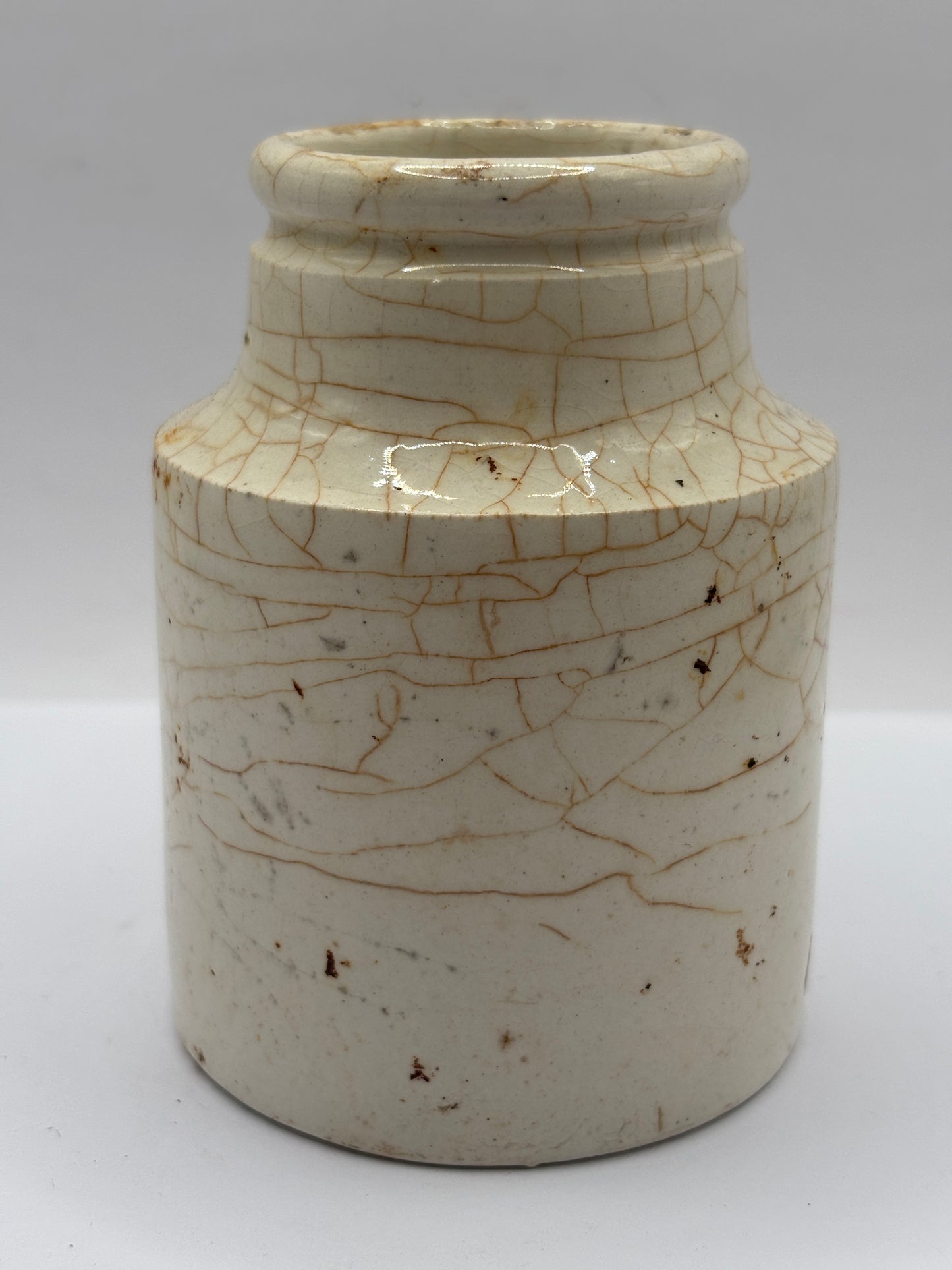 Old white stoneware jar, stained & crazed