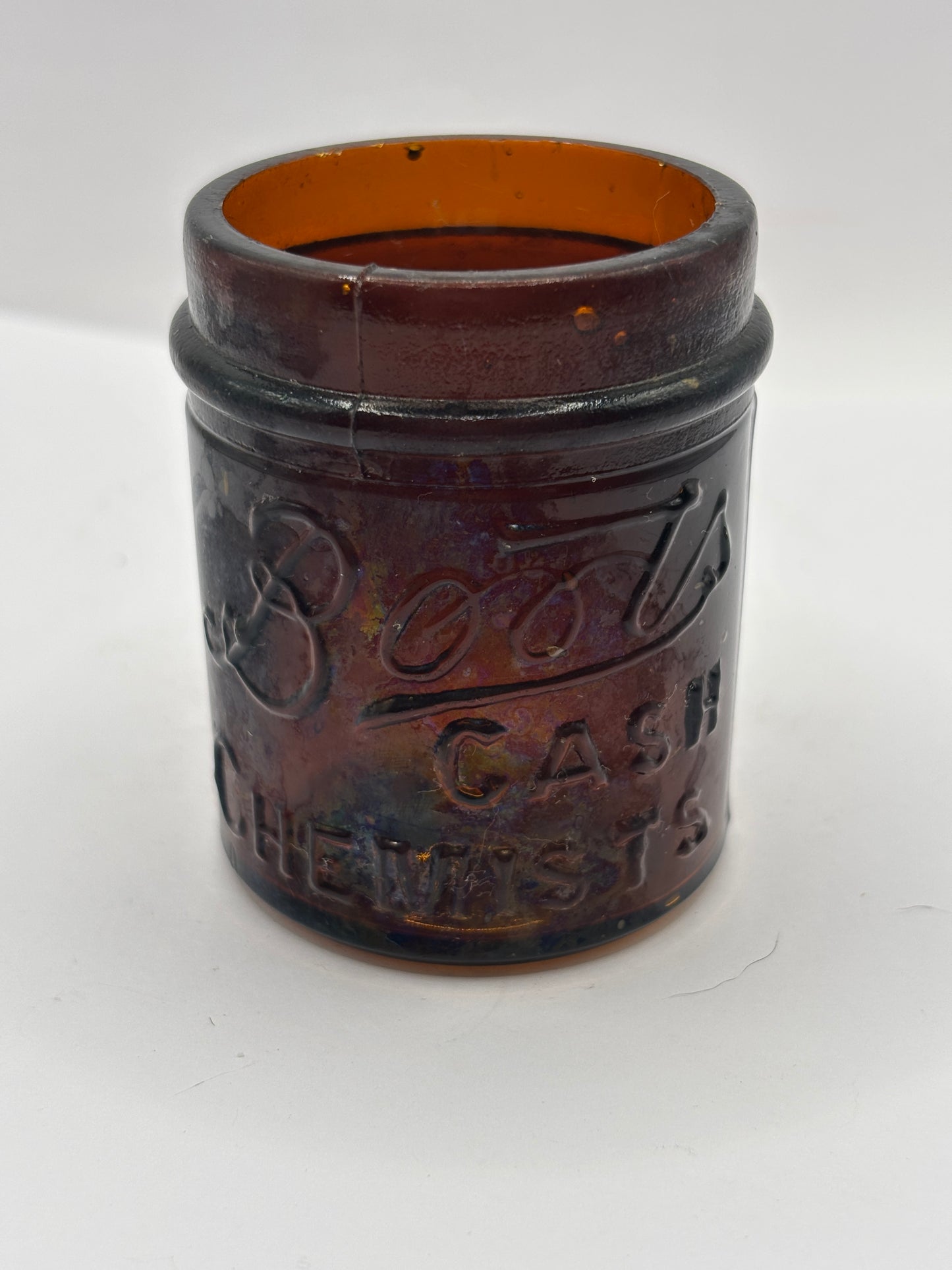 Small old amber glass boots jar