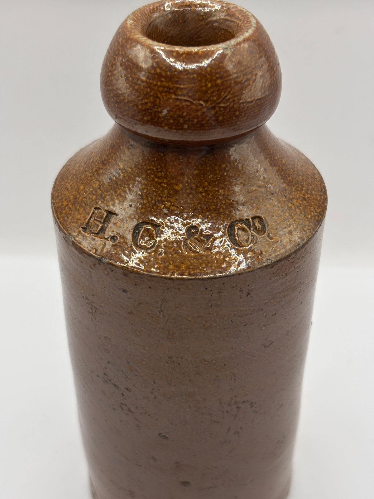 Old impressed stoneware ginger beer bottle, London. Hills chapman & co