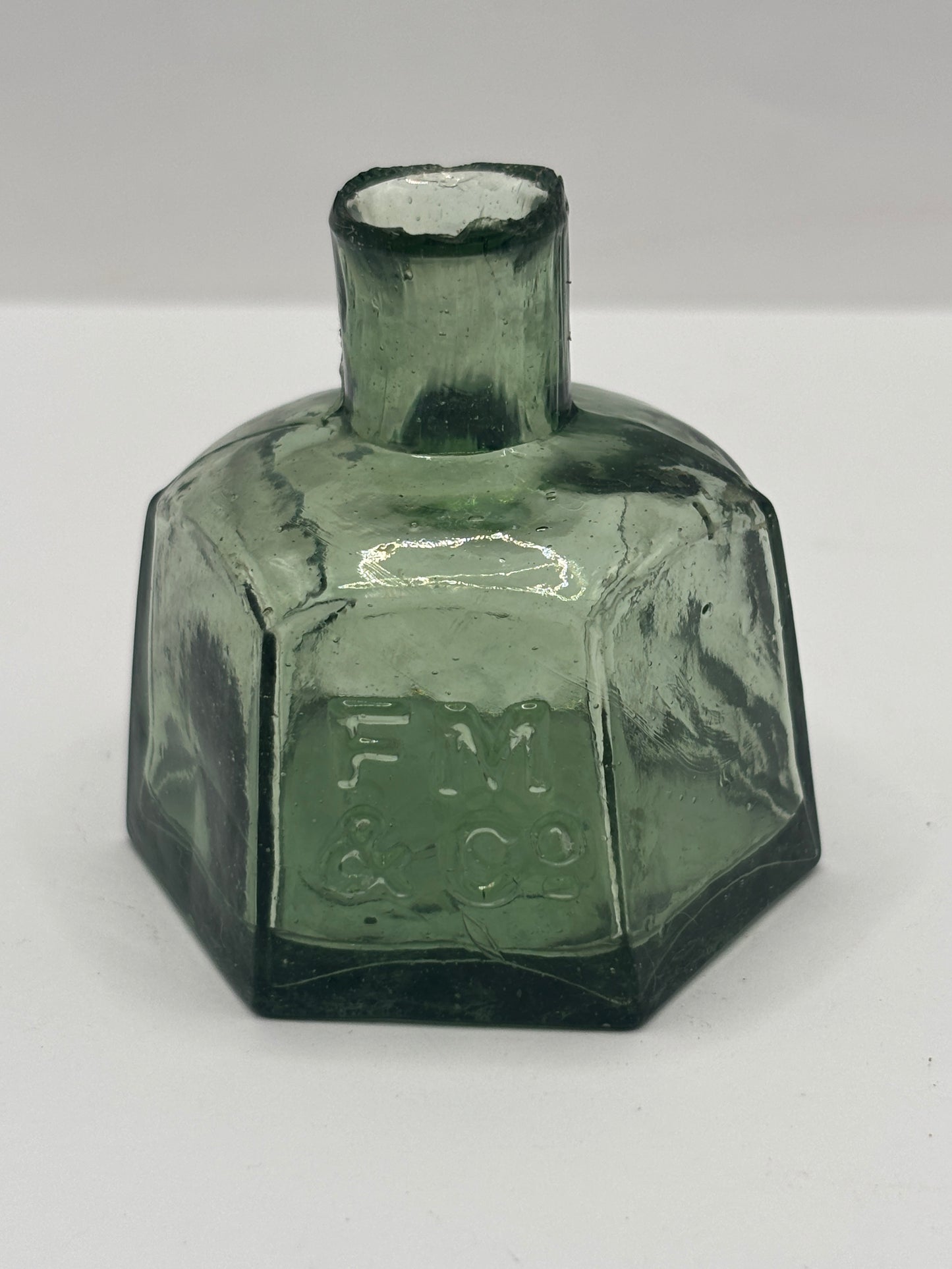 Old green glass advertising inkwell, penny ink, FM & Co