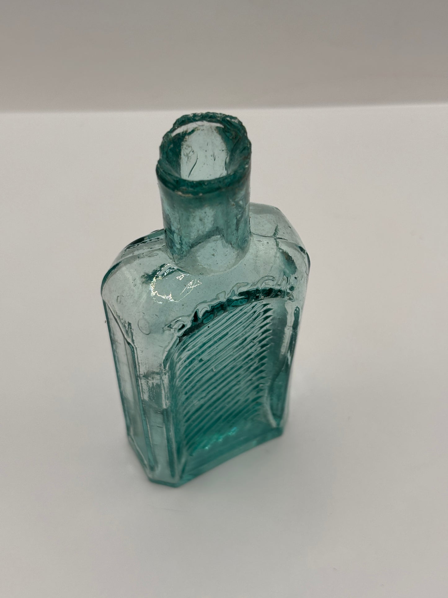 Old aqua glass poison bottle, not to be taken