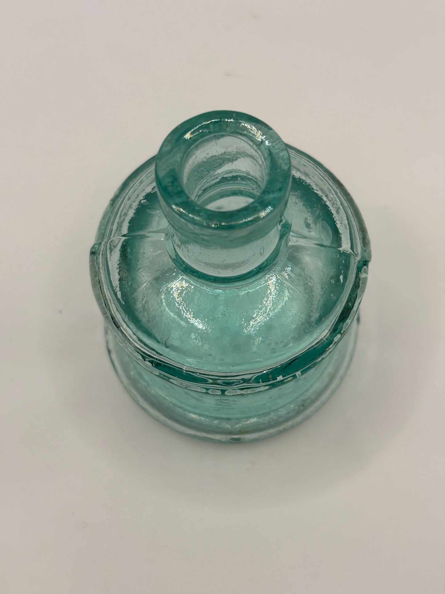 Old aqua glass advertising inkwell, ink bottle. Lyons ink