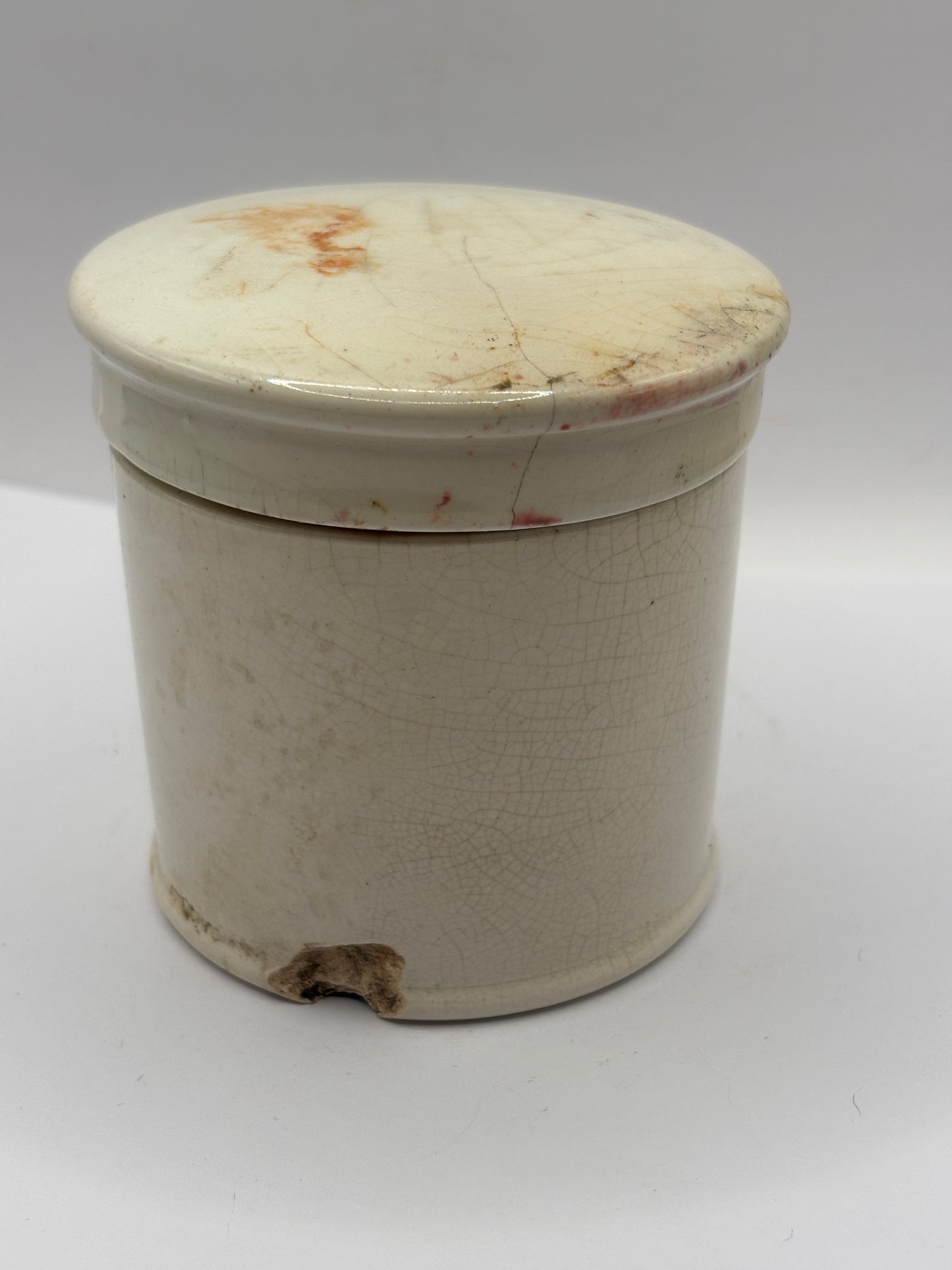 Old stoneware caviar jar and lid. Chipped