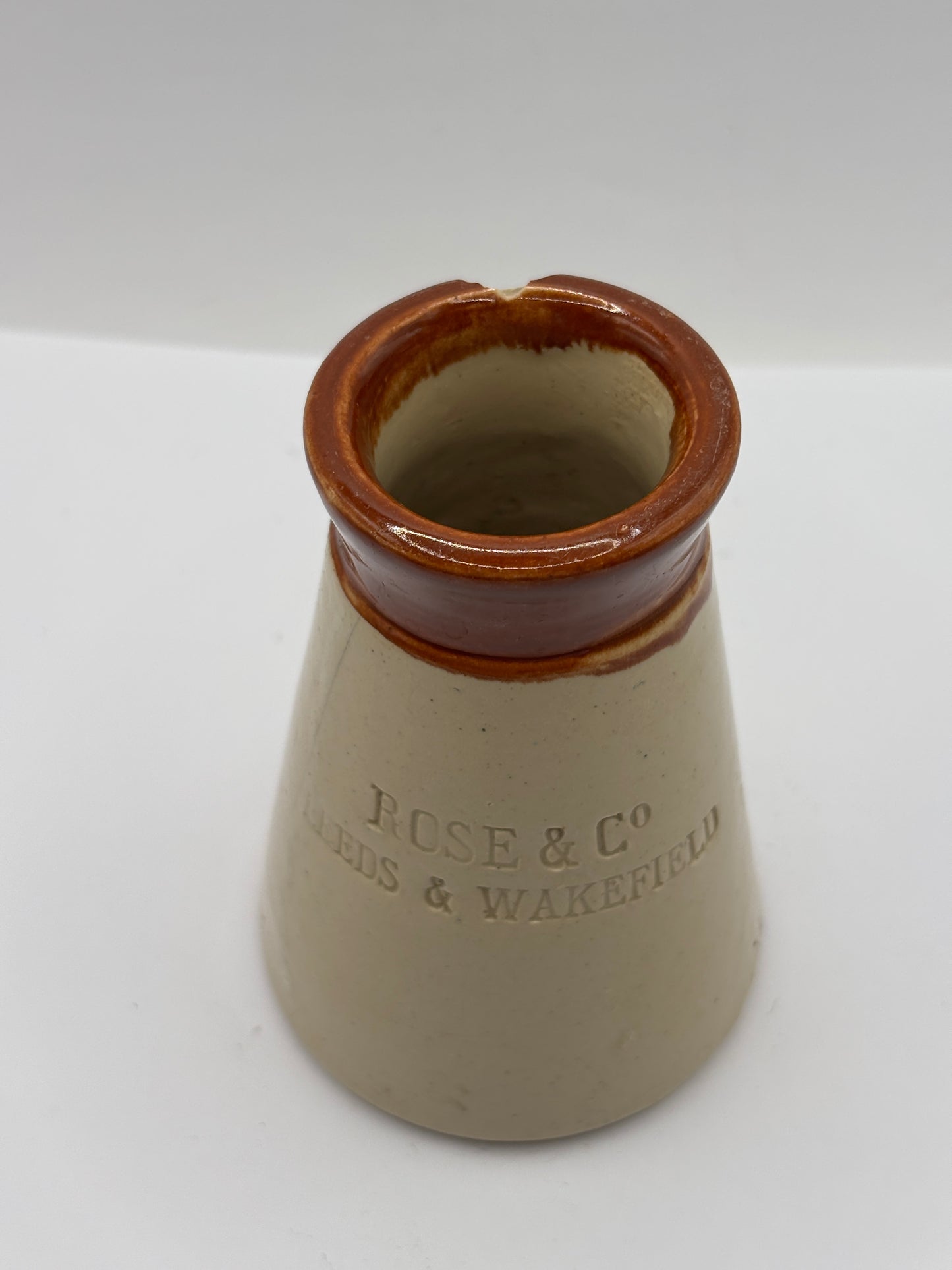 Old advertising cream pot, Rose & Co, Leeds & Wakefield. Damaged