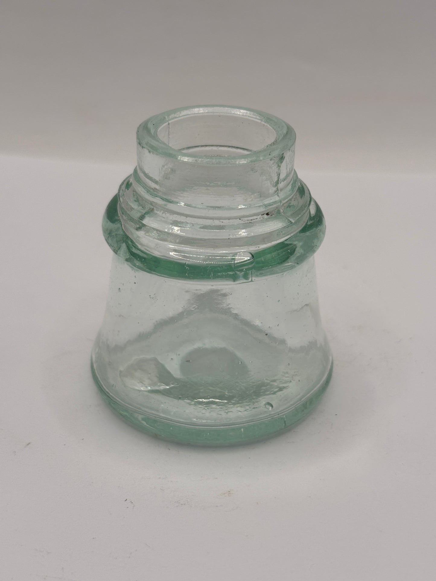 Old aqua glass inkwell. Ink bottle