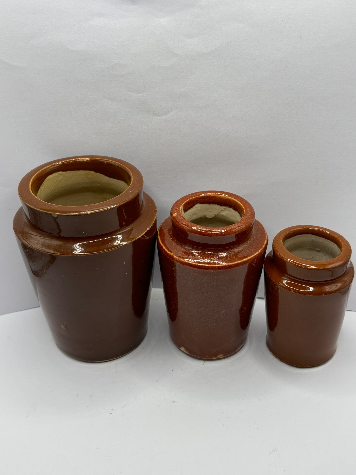 3 old brown stoneware cream pots, creamers