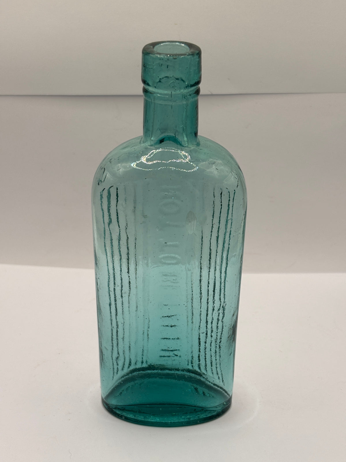 Old aqua glass poison bottle, POISONOUS not to be taken