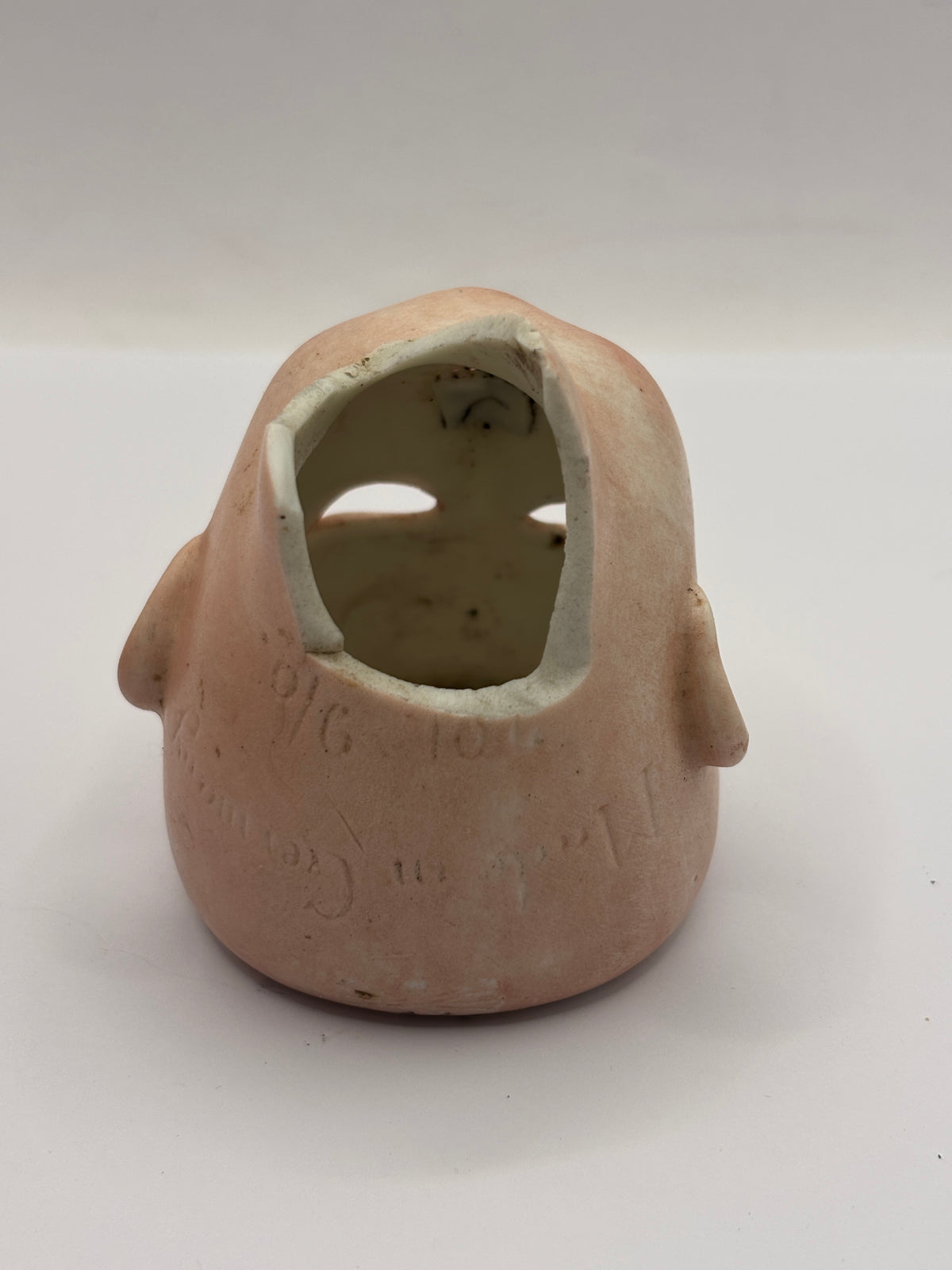 Old bisque dolls head, damaged
