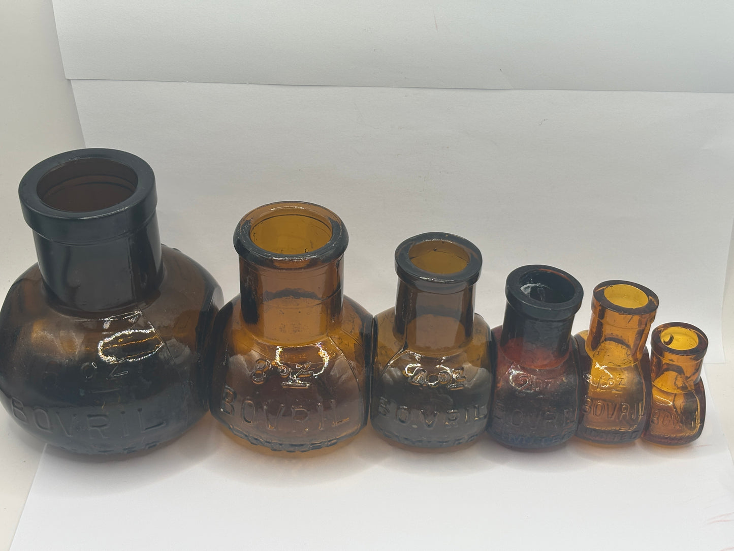 Old full set of amber glass bovril bottles 16oz-1/2 oz
