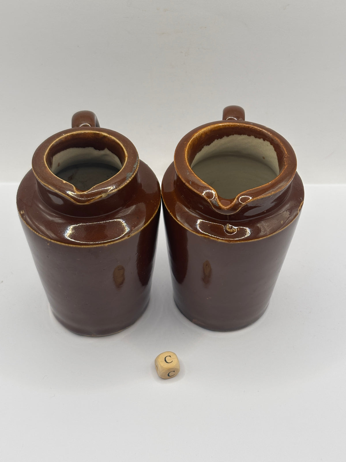 2 Old brown stoneware cream pots (C)