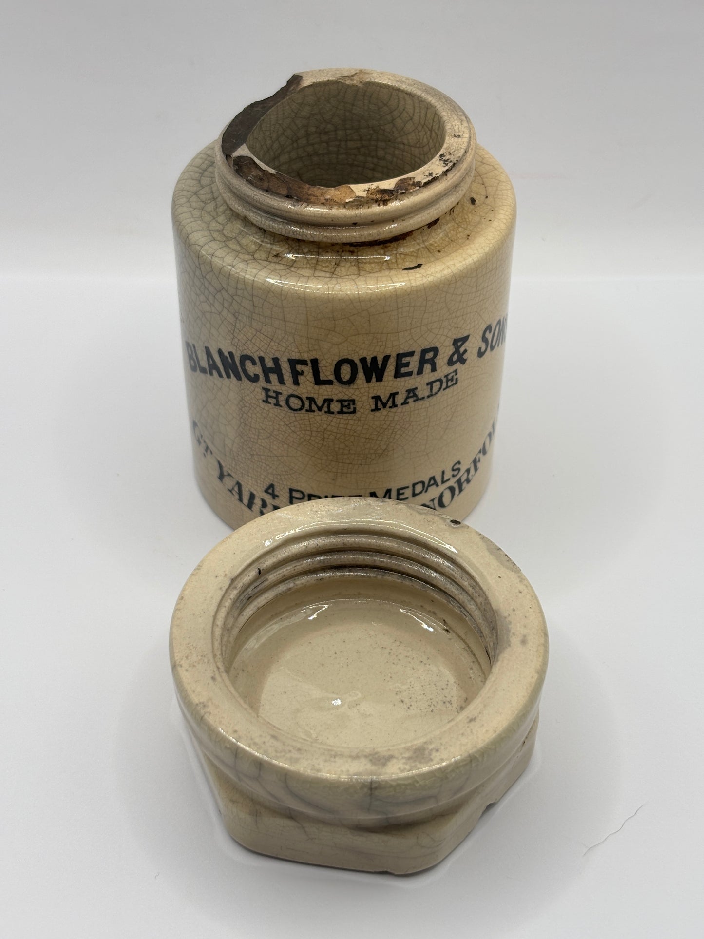 Old stoneware potted meat jar and lid. Blanchflower