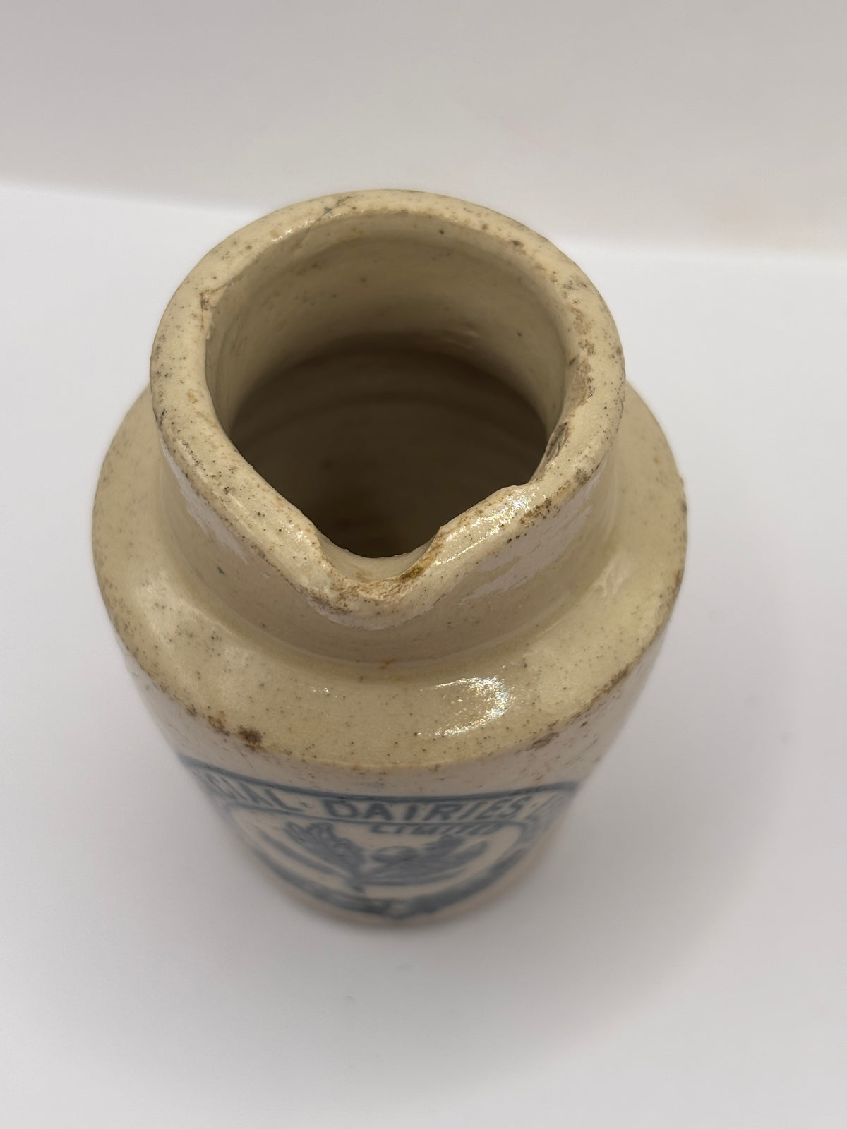 Old advertising cream pot, Provinical dairies Leeds. Chipped