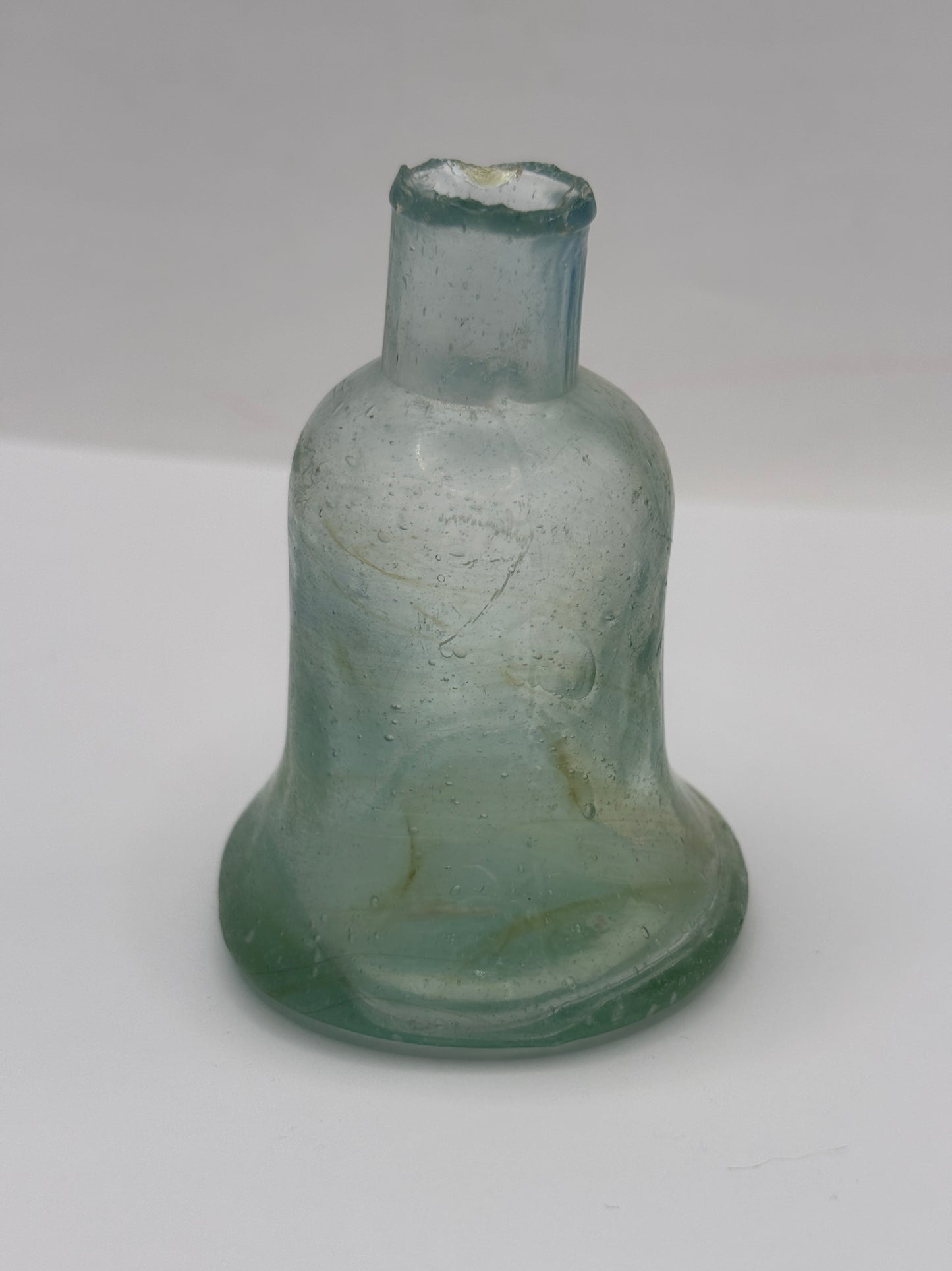 Old aqua glass inkwell, Bell ink. Swirly 7cms