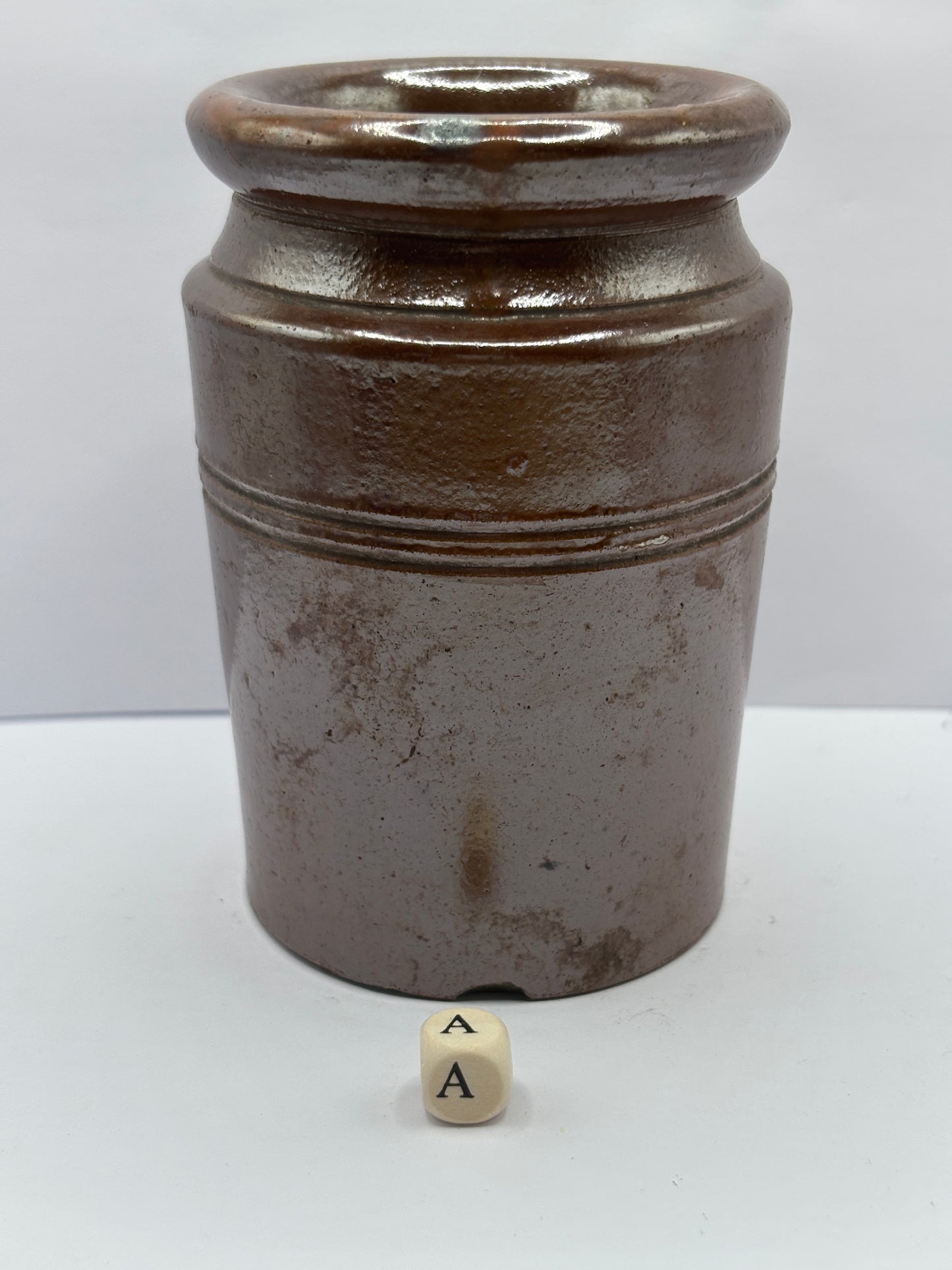 Old brown stoneware jar (a)