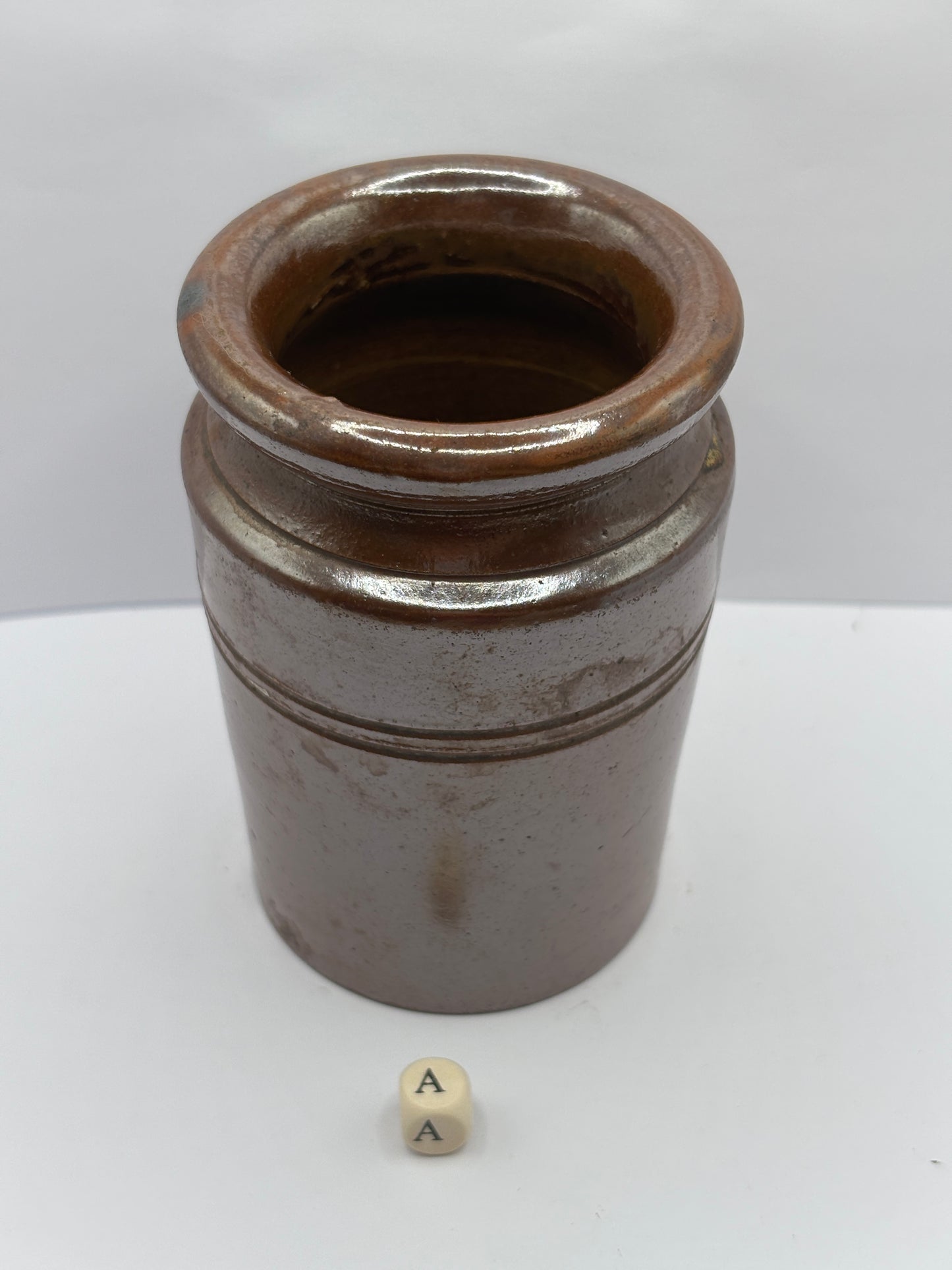 Old brown stoneware jar (a)