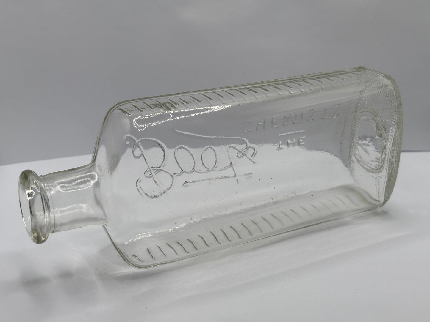 Old clear glass Boots chemist bottle