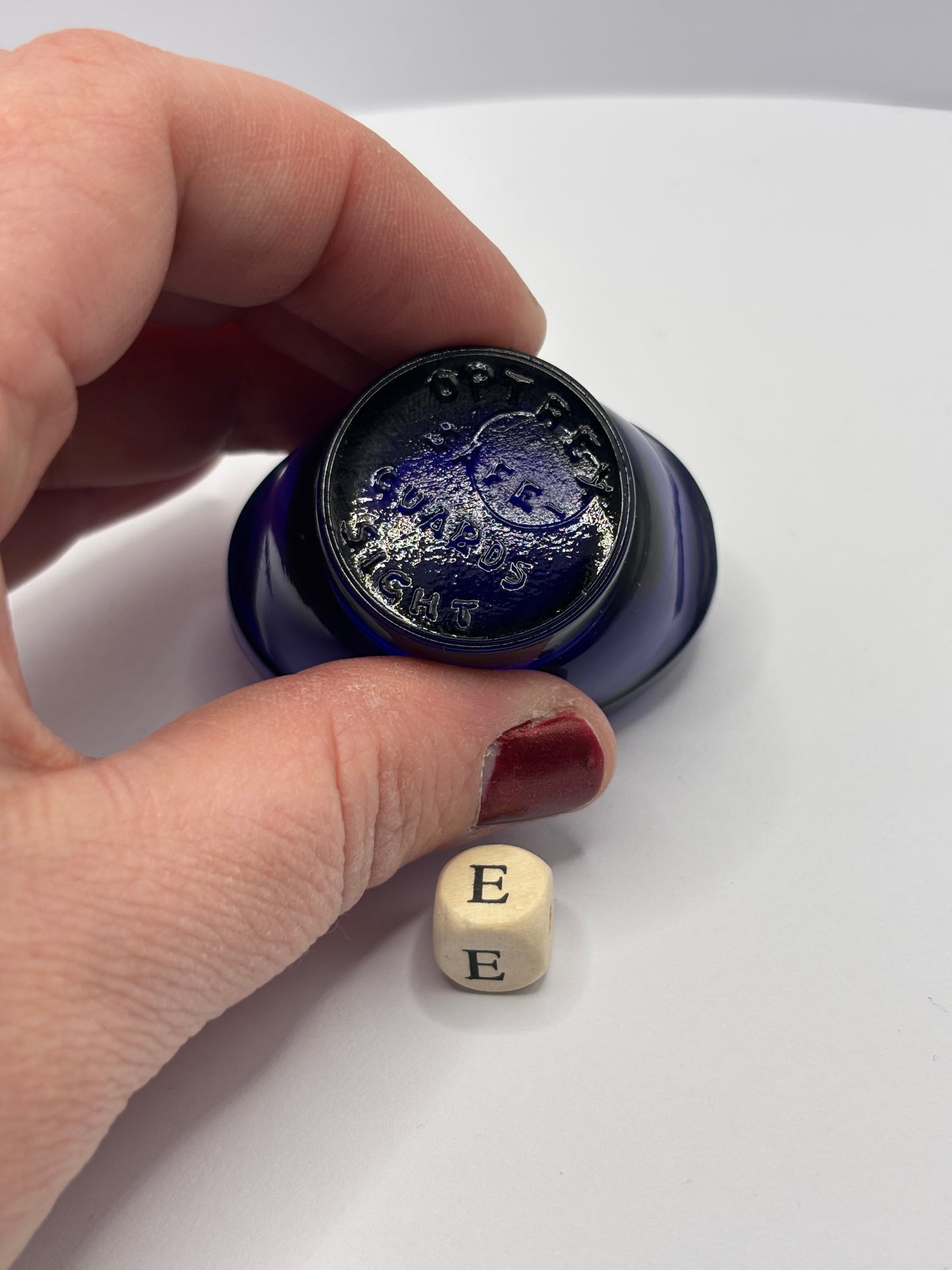 Old blue glass eye bath (e)