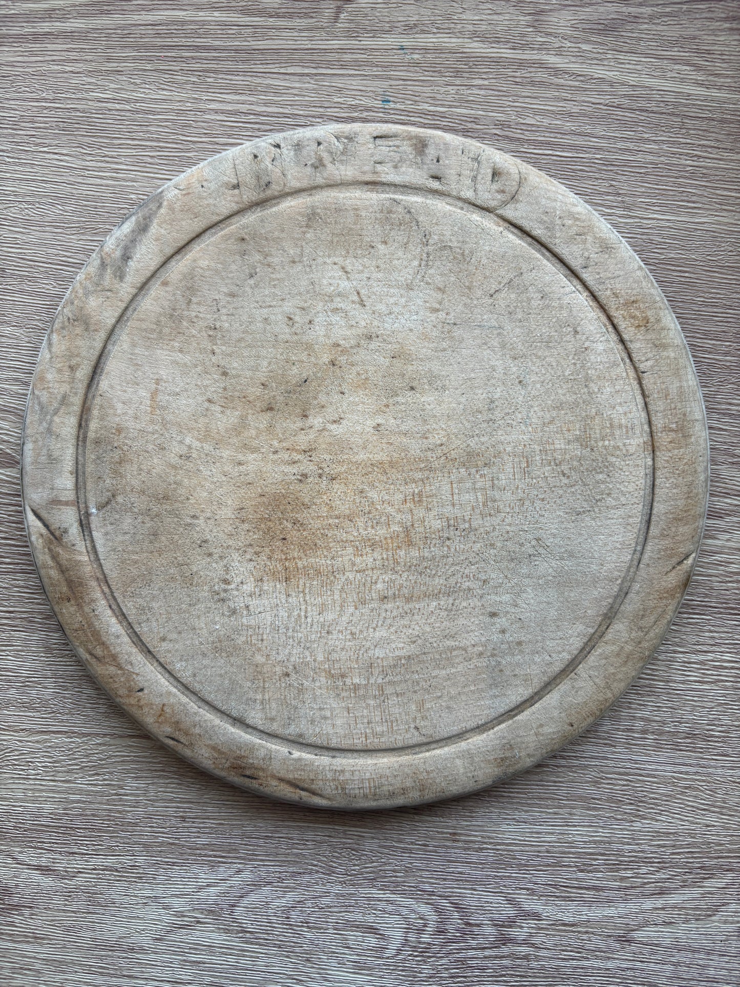 Old wooden carved bread board