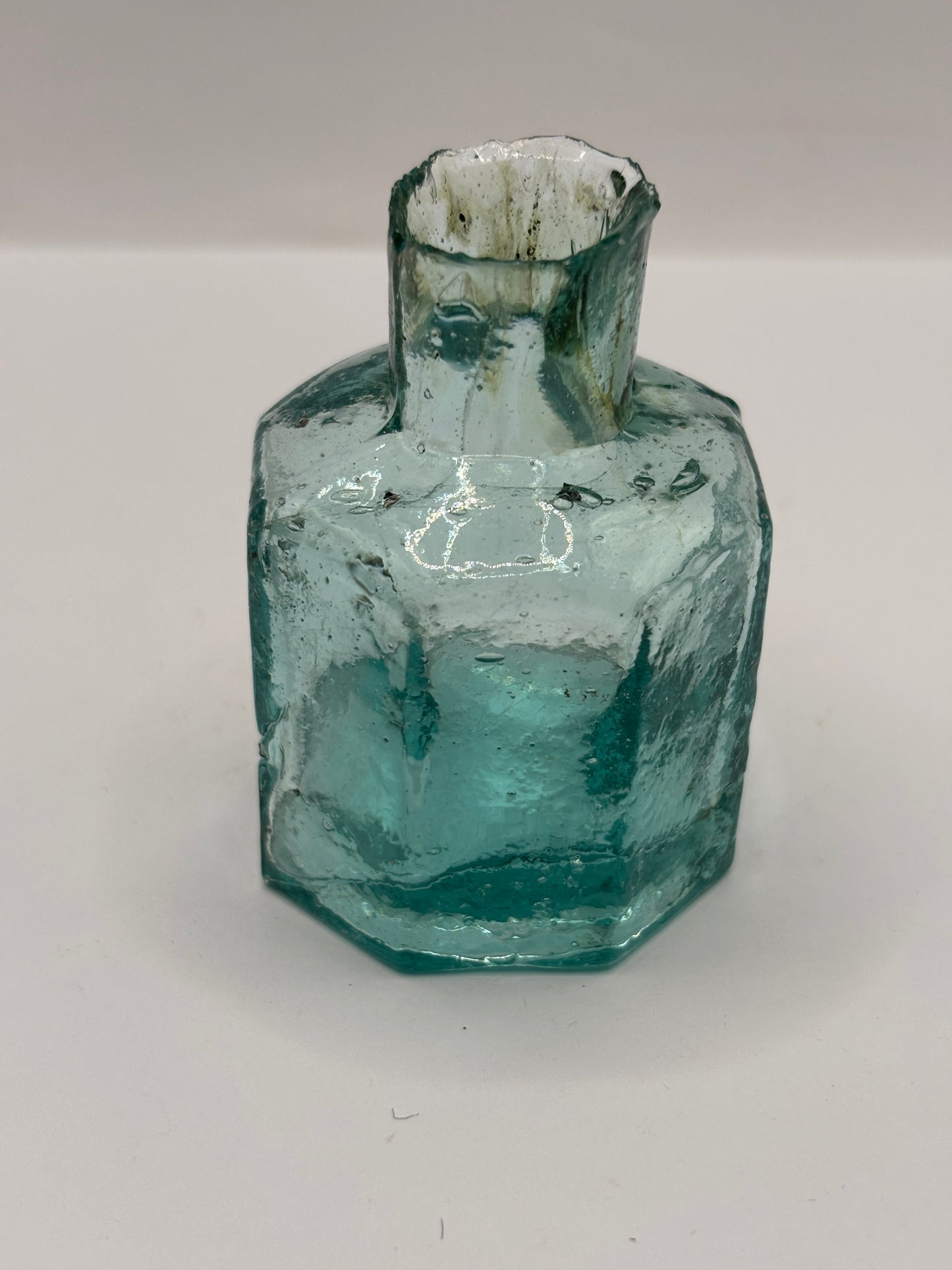 Old aqua glass inkwell with swirls, penny ink, ink bottle
