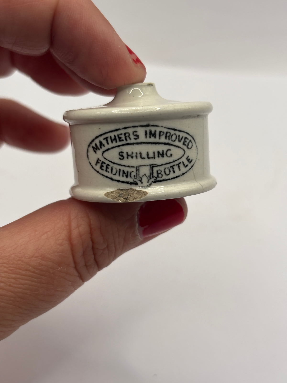 Old advertising baby feeder lid, Mathers improved feeding bottle lid