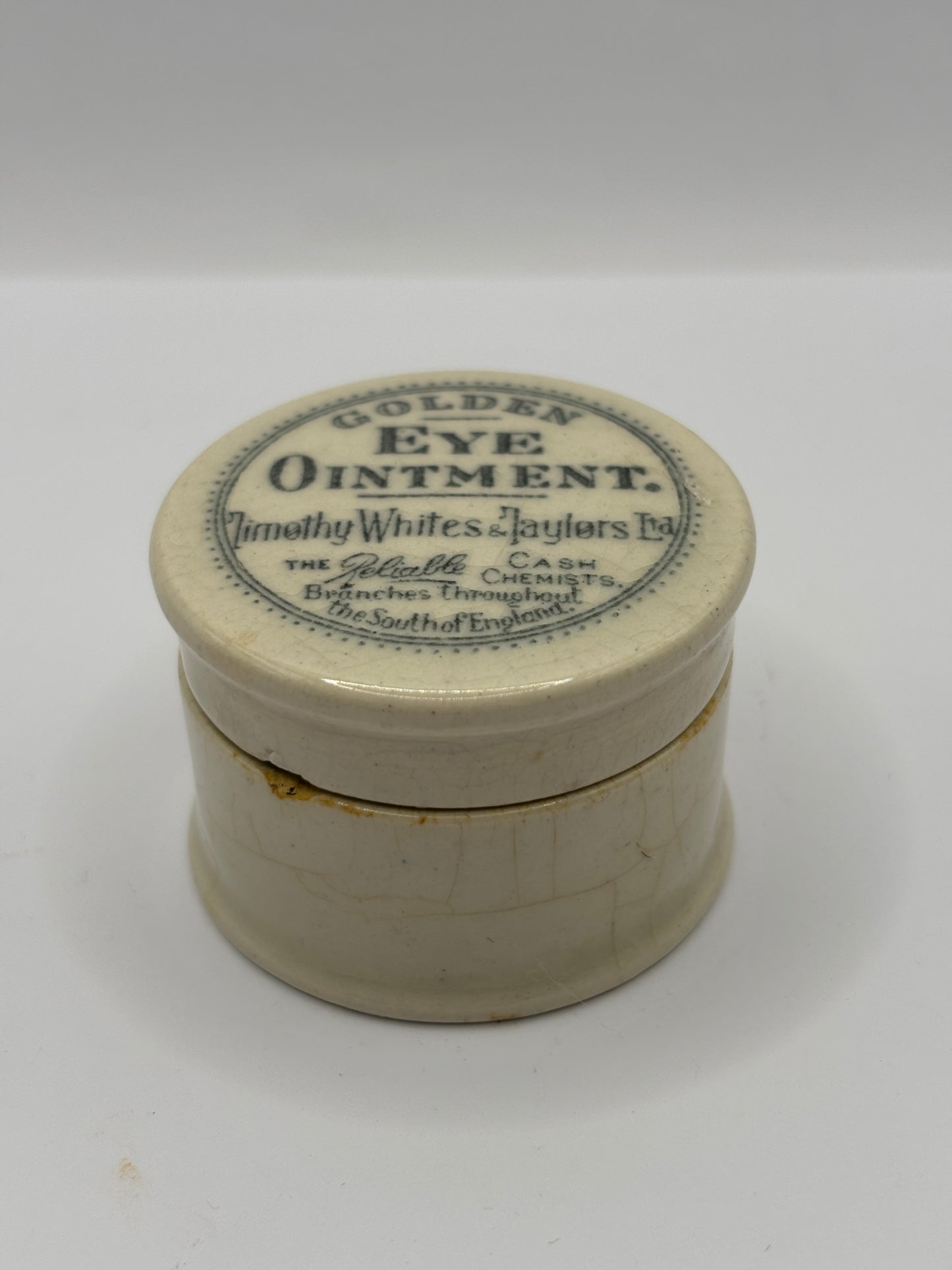 Old advertising lid and base, Timothy Whites Golden eye ointment