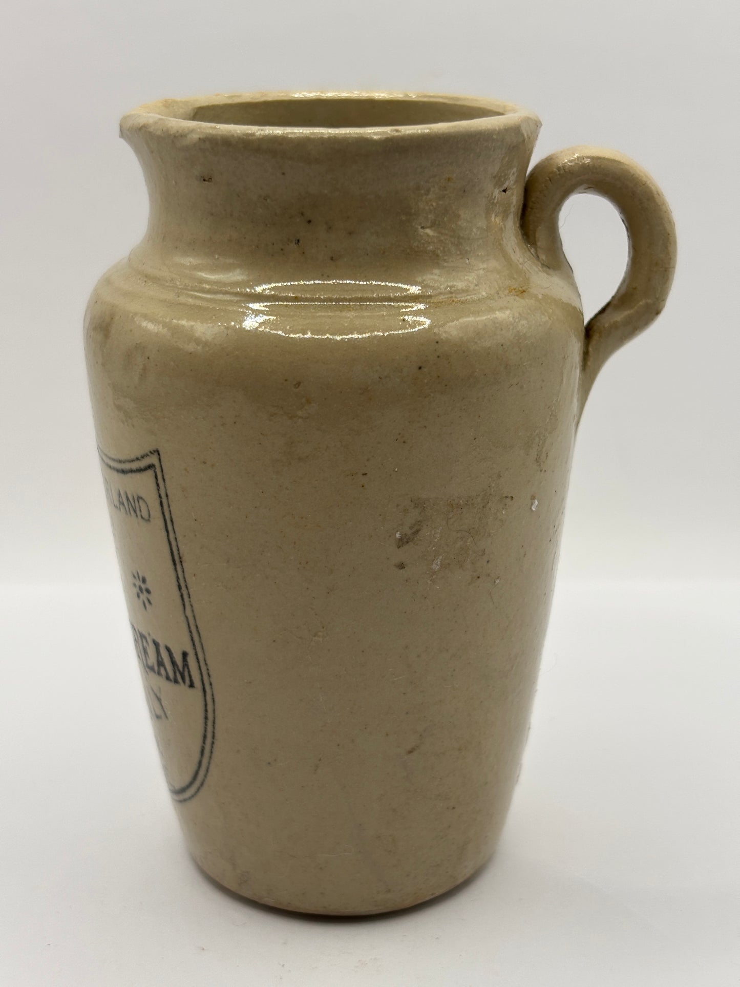 Old advertising cream pot, Carricks pure thick cream with handle. Black print 10cms