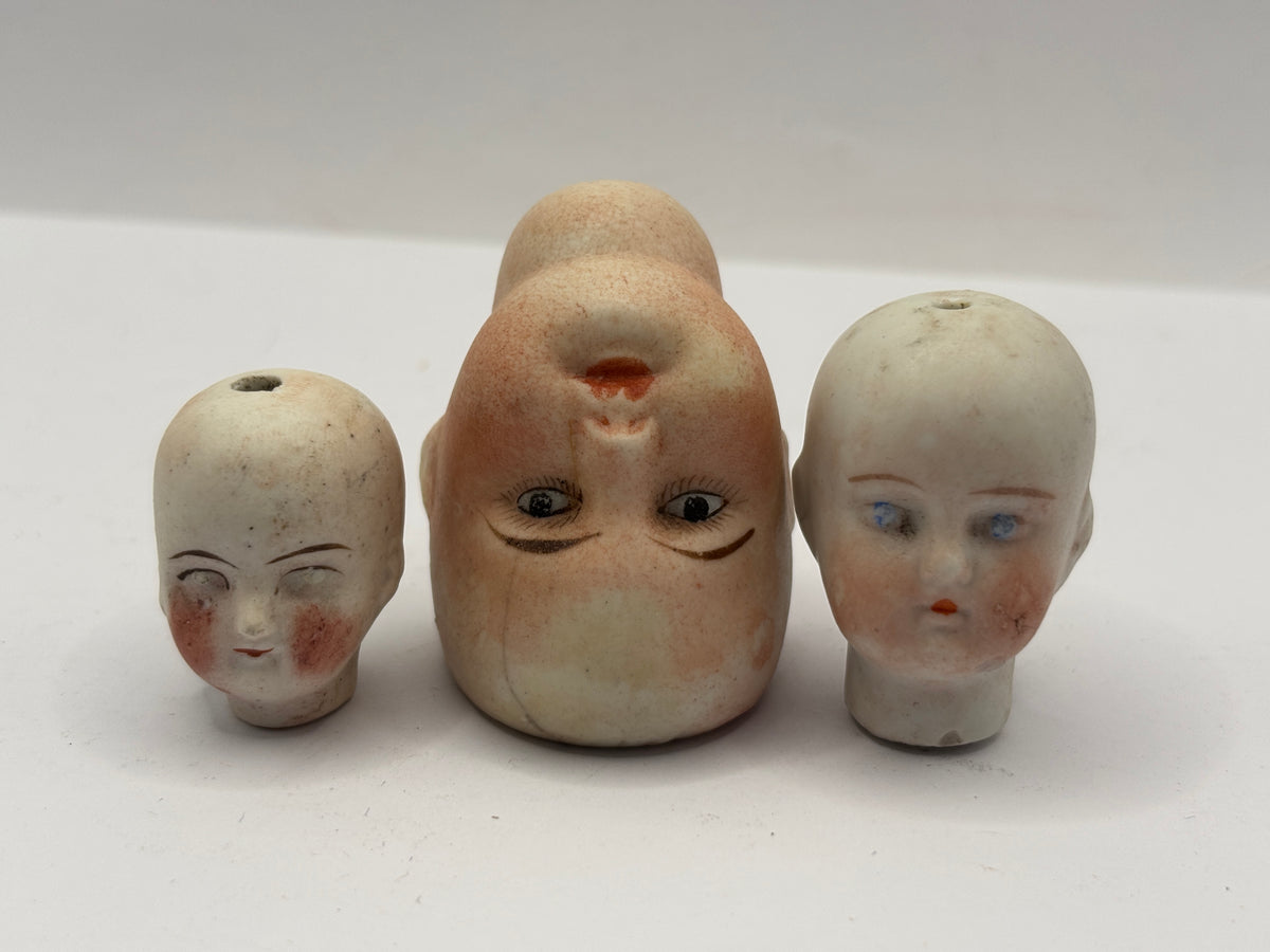 3 Old small bisque dolls heads