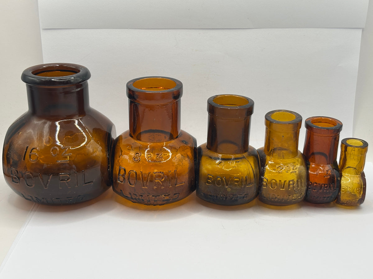 Full Set of 6 old amber glass Bovril bottles. 16oz- 0.5oz