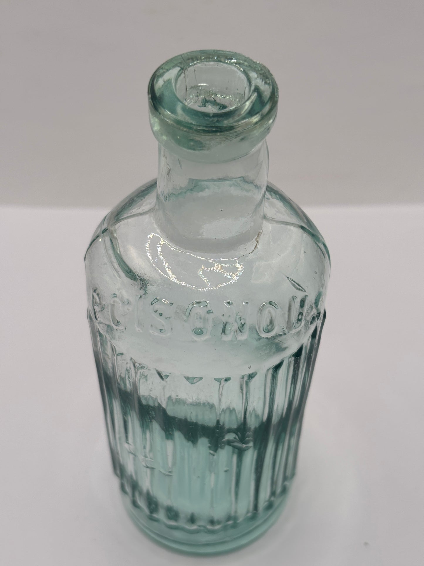 Old aqua glass poison bottle, Poisonous, not to be taken