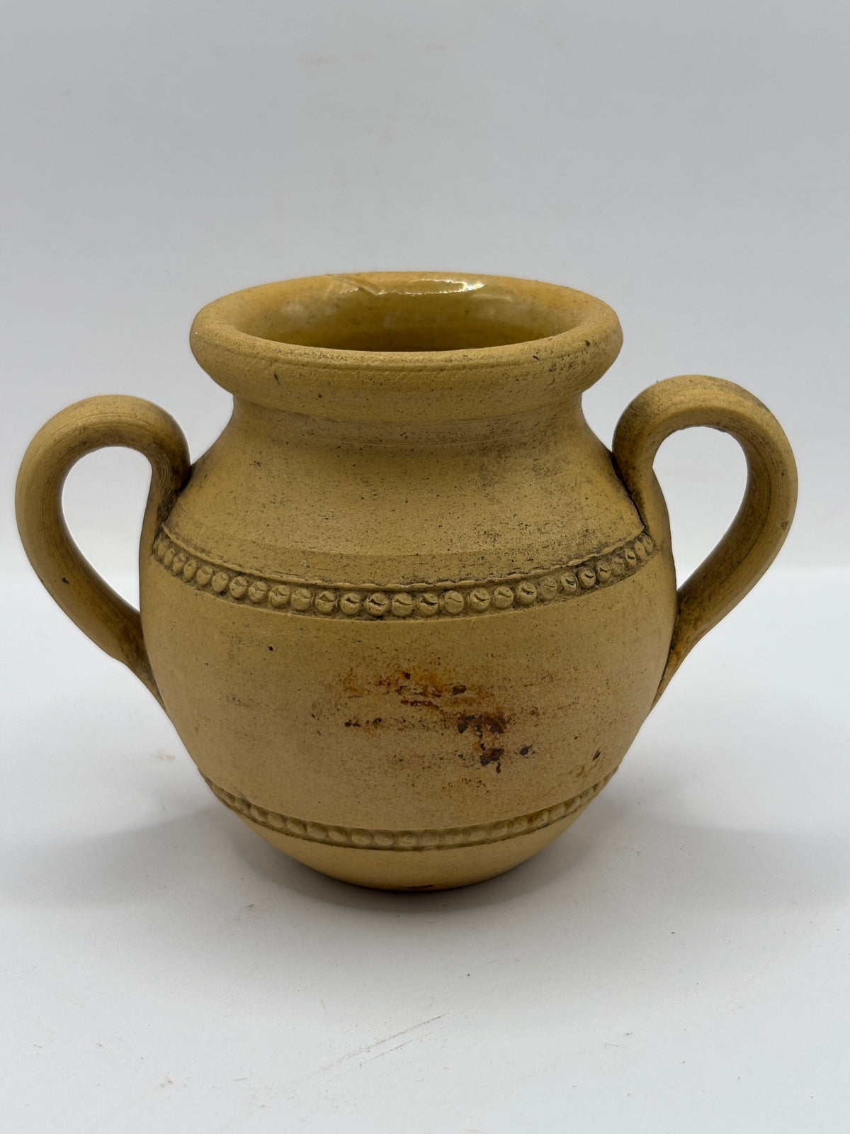 Old stained stoneware handled jug
