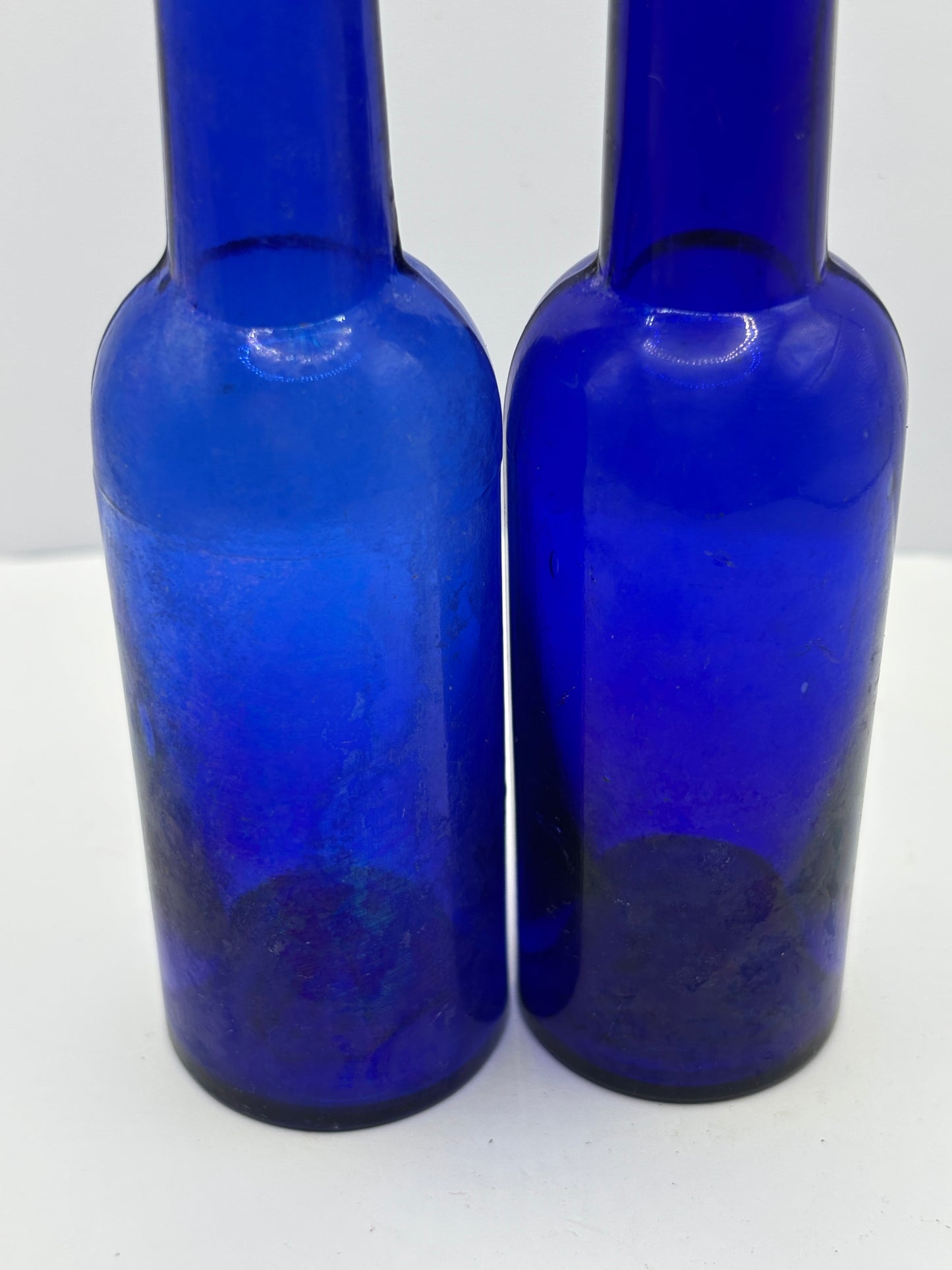 2 old blue castor oil bottles