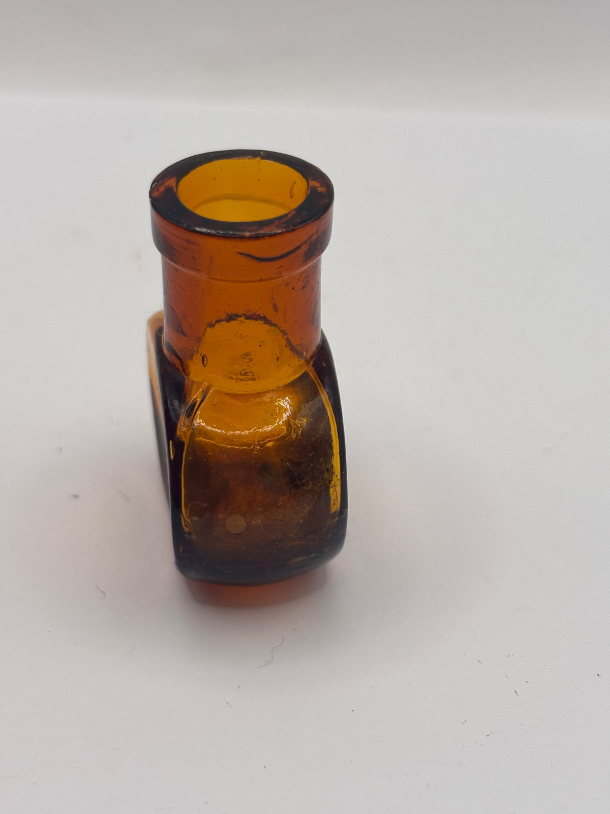 Old mini 1oz amber glass advertising Bovril bottle