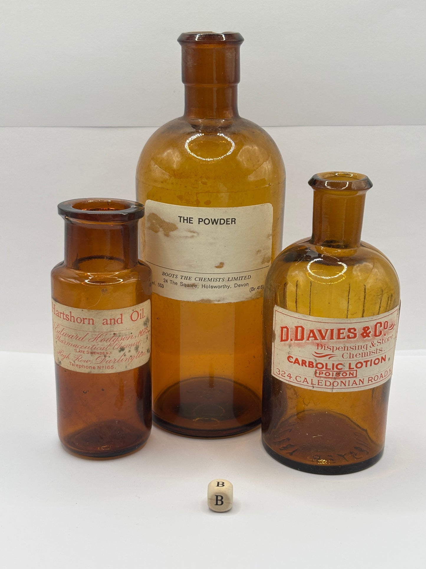 3 old chemist bottles with added labels (B)