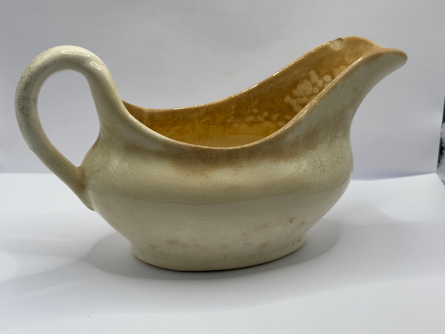 Old stained & crazed handled jug, gravy boat