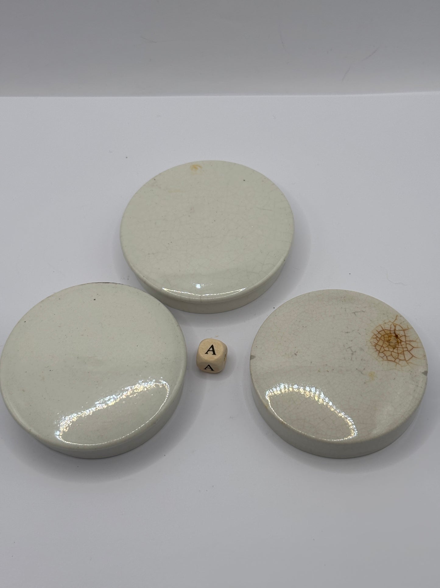 3 old plain stoneware lids (a)