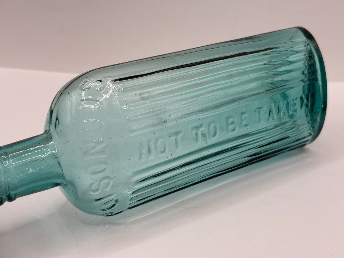 Old aqua glass poison bottle, POISONOUS not to be taken