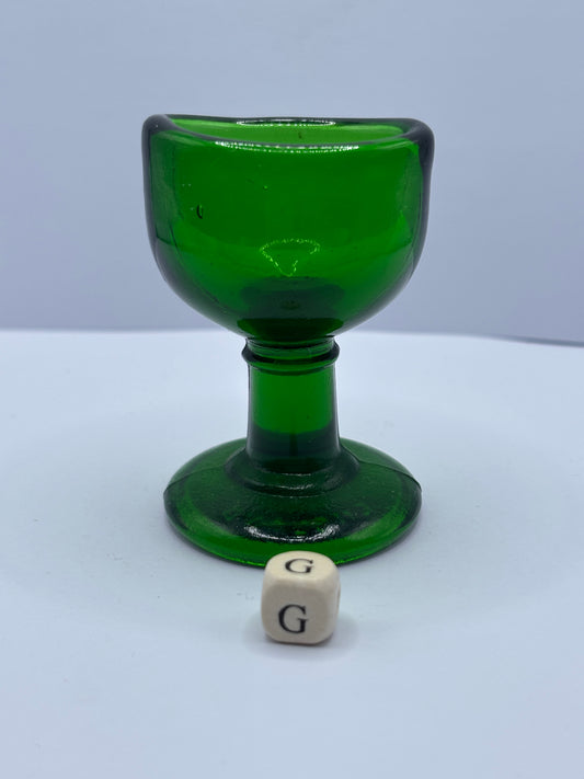 Old green glass eye bath (G)