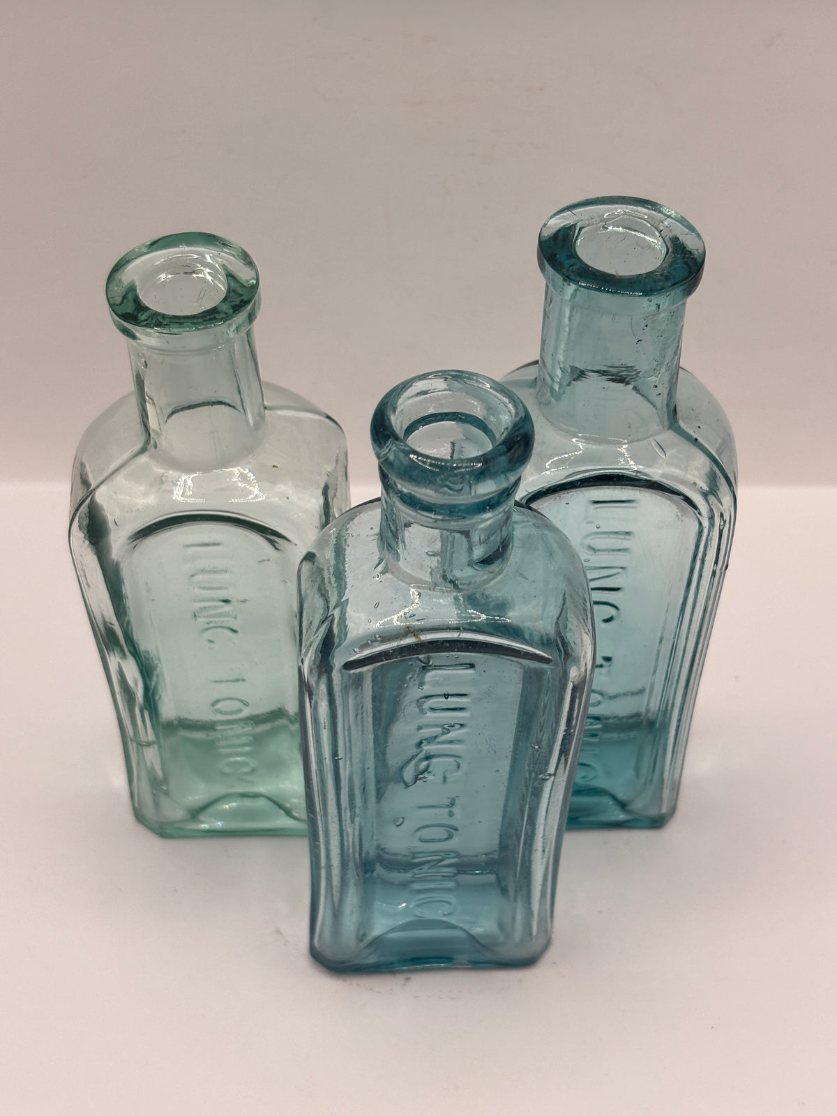 2 old aqua glass Lung tonic bottles