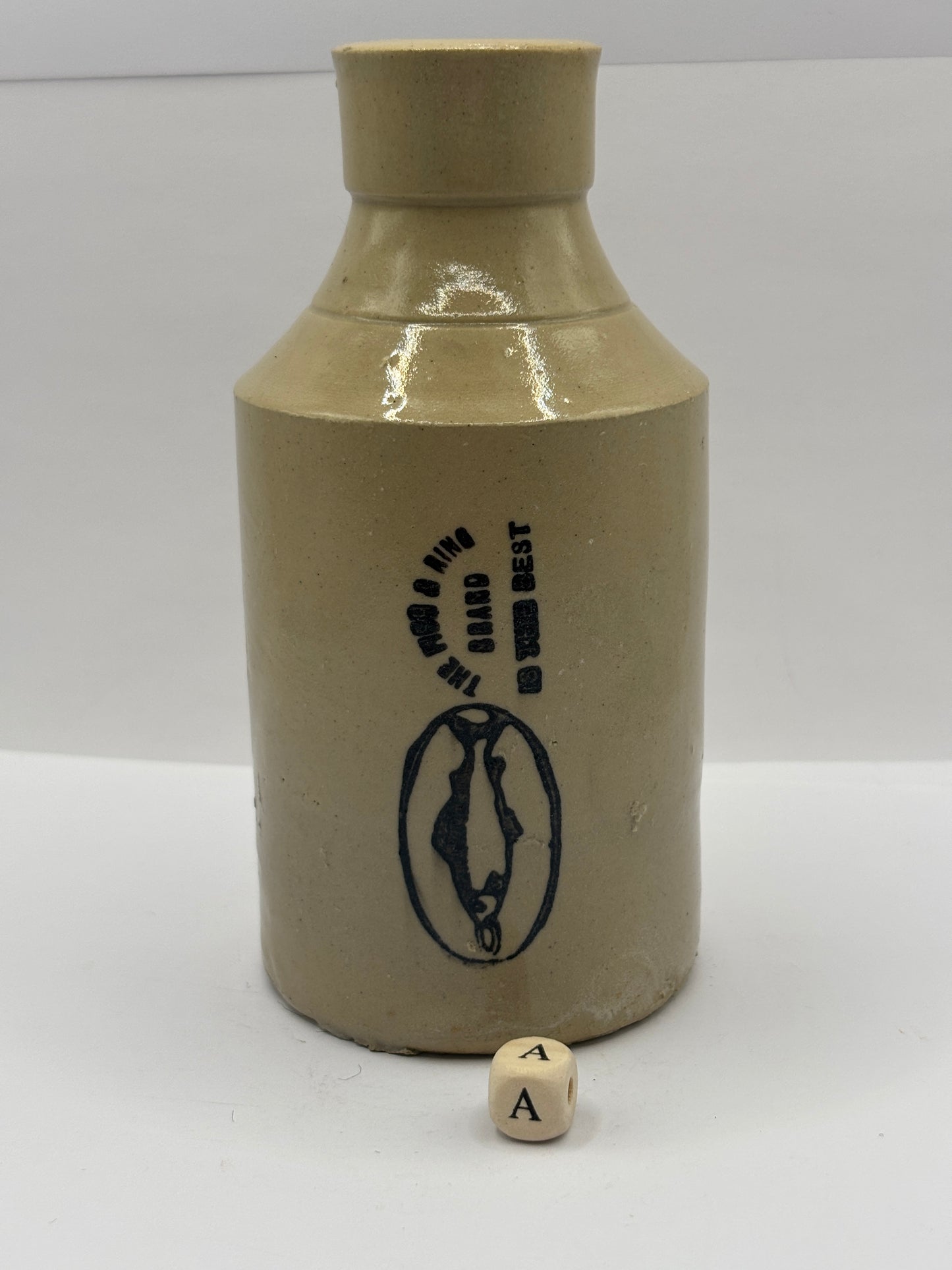 Old stoneware Fish & Ring brand advertising bottle (a)