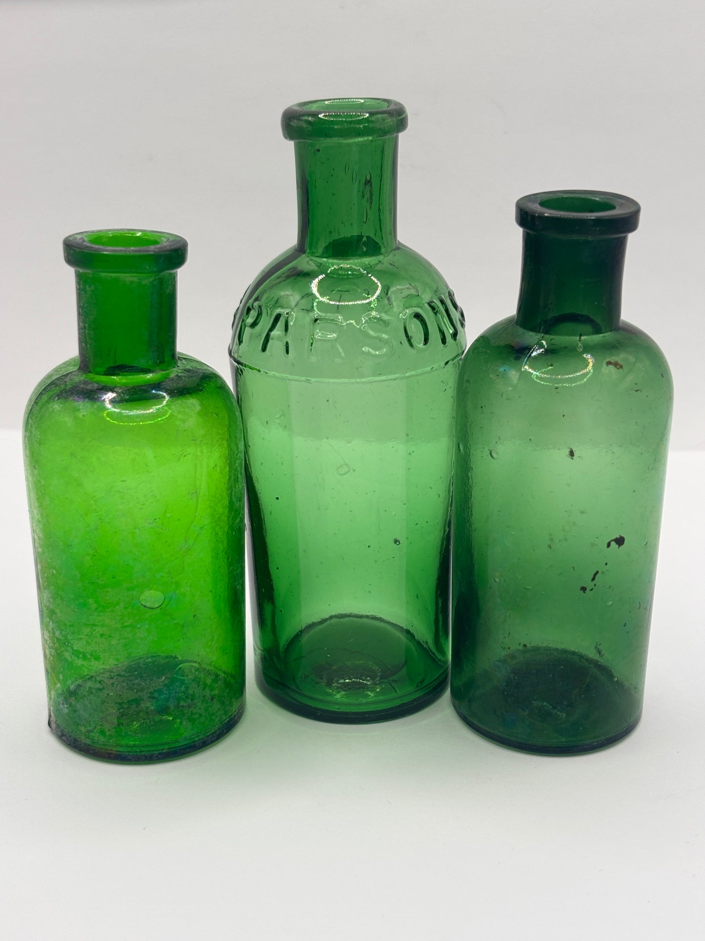 3 old green glass bottles
