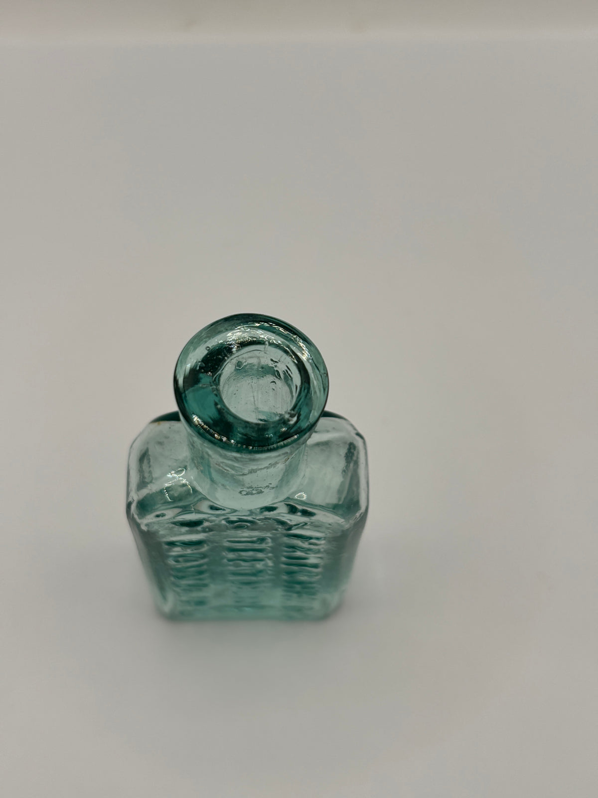 Old aqua glass advertising bottle. Try Pritchards teething powders