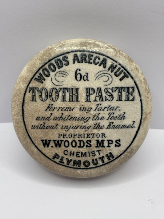 Old woods are a nut advertising toothpaste pot lid, stained & crazed