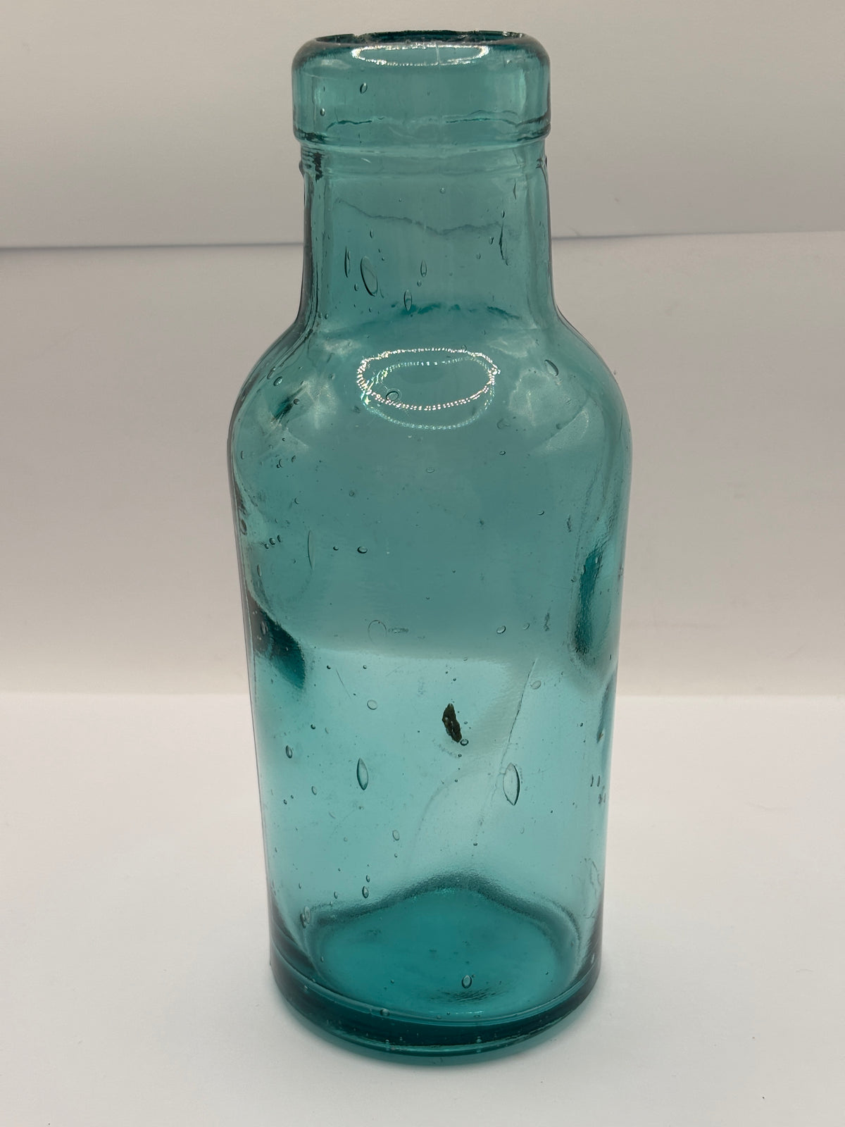 Old dark aqua glass jar